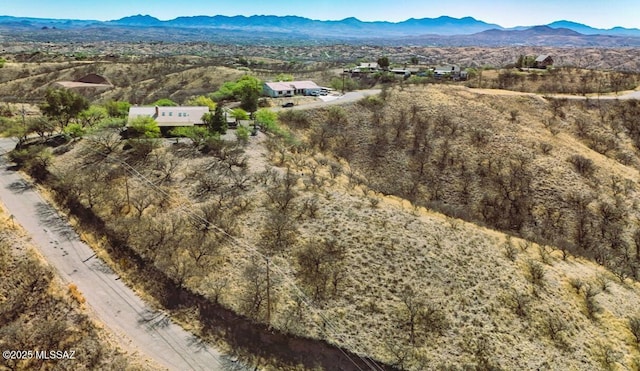 birds eye view of property featuring a mountain view