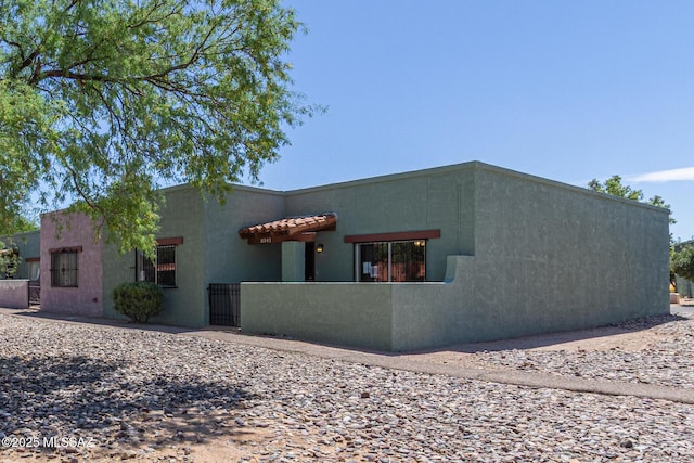 8341 E Placita Prado, Tucson, AZ 85710 - back of property featuring stucco siding and a gate