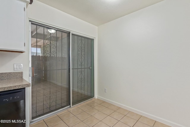 8341 E Placita Prado, Tucson, AZ 85710 - spare room featuring baseboards and light tile patterned flooring