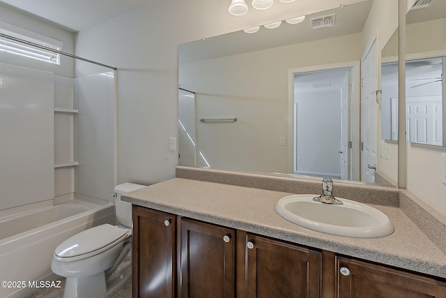 full bathroom with visible vents, washtub / shower combination, toilet, and vanity