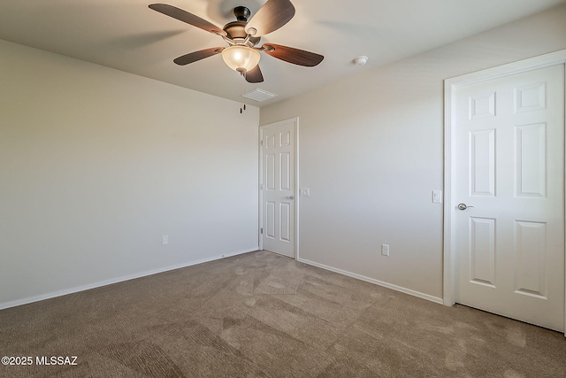 unfurnished bedroom featuring visible vents, carpet, ceiling fan, and baseboards