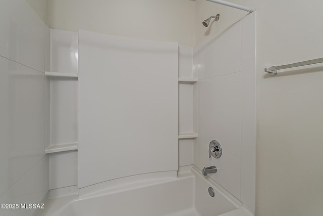 bathroom with shower / washtub combination