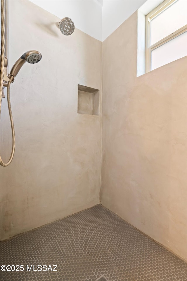 interior space with tiled shower