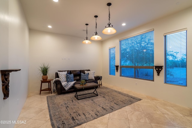 living room with tile patterned flooring and recessed lighting