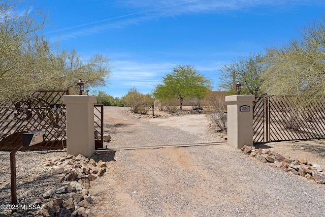 view of gate featuring fence