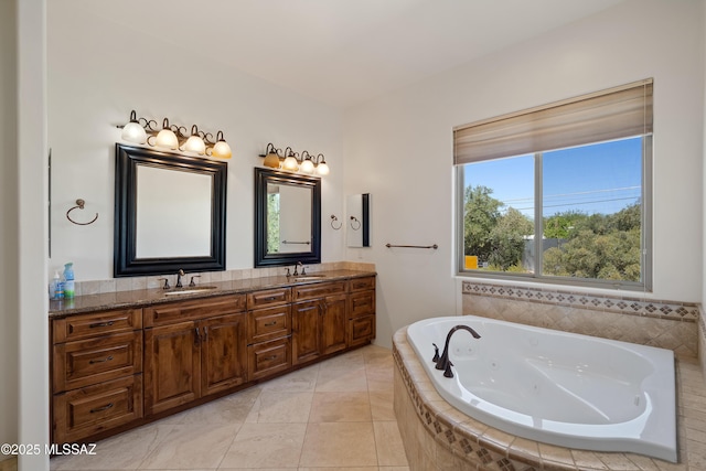 full bath with plenty of natural light, a sink, and a tub with jets
