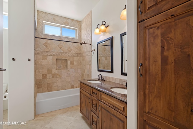 full bathroom with double vanity,  shower combination, a sink, and tile patterned floors