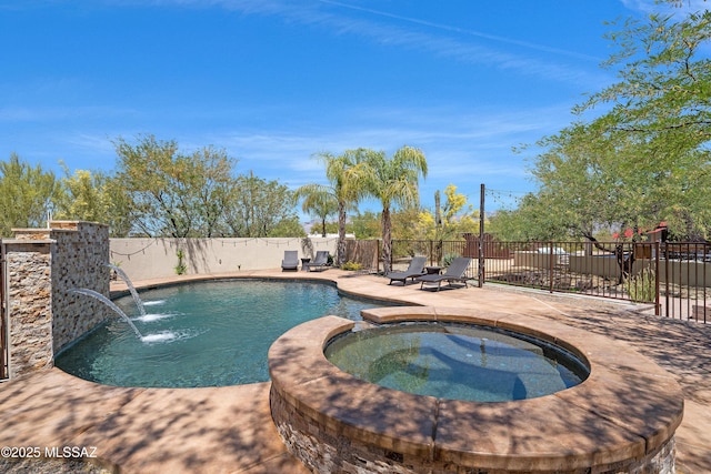 view of swimming pool featuring a patio, a fenced backyard, and a pool with connected hot tub