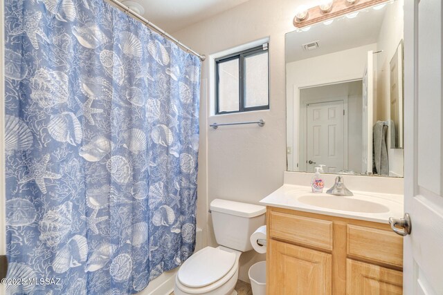 1320 S Via Estrella Roja, Tucson, AZ 85713 - bathroom with vanity, toilet, and a shower with shower curtain