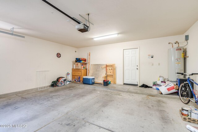 1320 S Via Estrella Roja, Tucson, AZ 85713 - garage with water heater and a garage door opener
