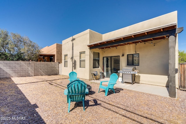 1320 S Via Estrella Roja, Tucson, AZ 85713 - back of house with stucco siding, a fenced backyard, and a patio