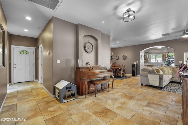 1351 Alma Ct, Rio Rico, AZ 85648 - living area featuring visible vents, recessed lighting, and arched walkways