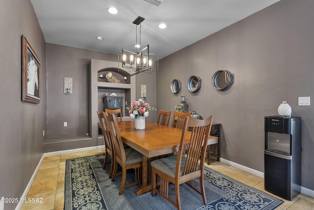 1351 Alma Ct, Rio Rico, AZ 85648 - dining area featuring baseboards, recessed lighting, light tile patterned floors, and an inviting chandelier