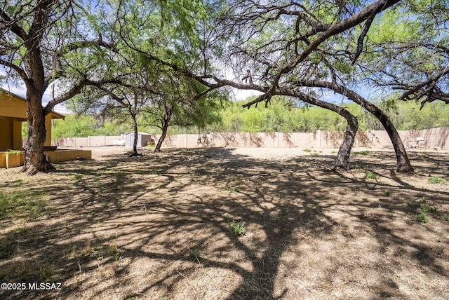 1351 Alma Ct, Rio Rico, AZ 85648 - view of yard with a fenced backyard, an outbuilding, and a storage shed