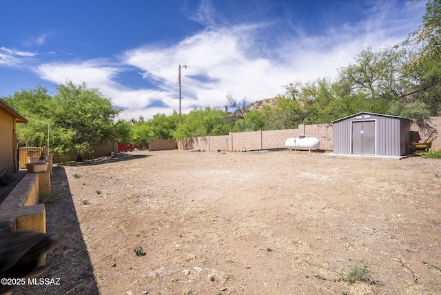 1351 Alma Ct, Rio Rico, AZ 85648 - view of yard with a storage unit, an outbuilding, and a fenced backyard