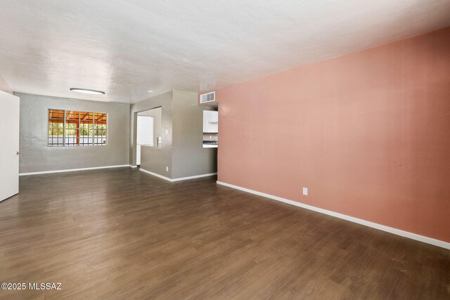 unfurnished bedroom featuring concrete flooring, a closet, visible vents, and baseboards