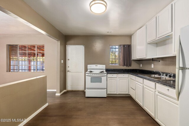 unfurnished room with baseboards and concrete flooring