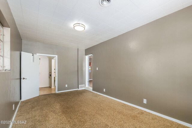 unfurnished room with carpet and a healthy amount of sunlight
