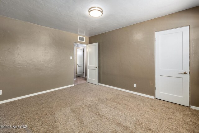 interior space with unfinished concrete floors and baseboards