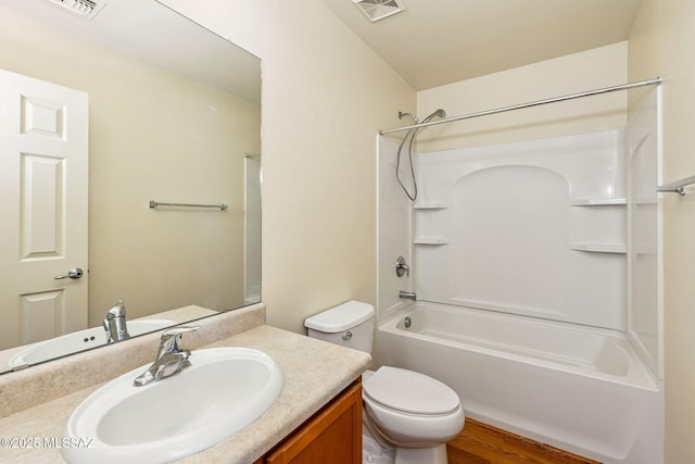 bathroom featuring shower / bath combination, visible vents, vanity, and toilet