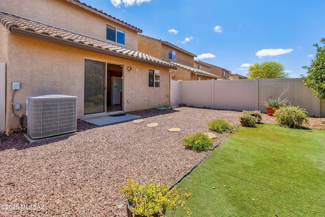 view of yard featuring cooling unit and a fenced backyard