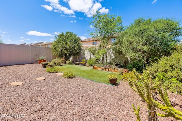 view of yard featuring a fenced backyard