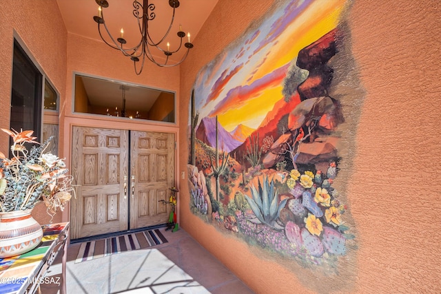property entrance with stucco siding