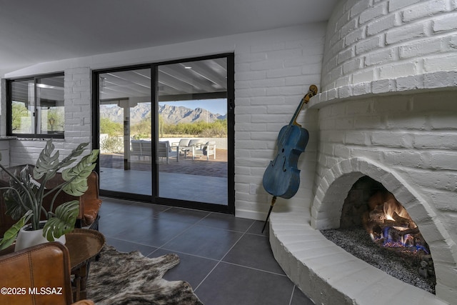 1720 W Cessna Way, Tucson, AZ 85755 - doorway featuring tile patterned floors, a mountain view, and a brick fireplace