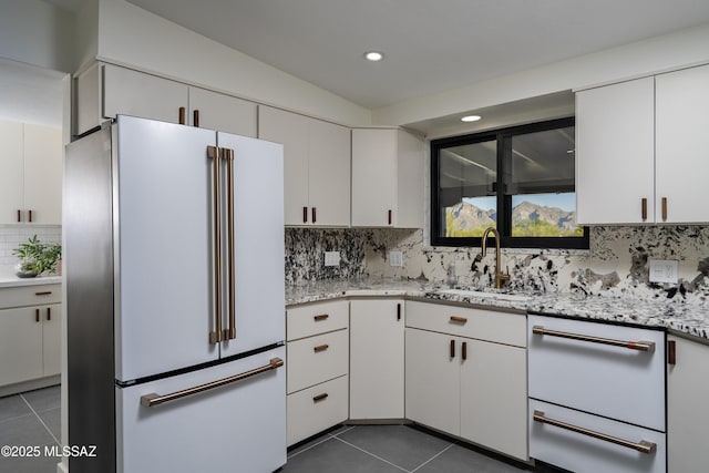 1720 W Cessna Way, Tucson, AZ 85755 - kitchen with high end white refrigerator, dark tile patterned floors, a sink, recessed lighting, and backsplash
