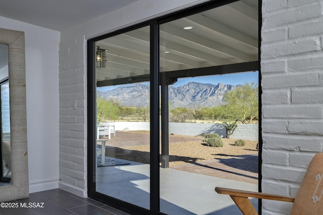 1720 W Cessna Way, Tucson, AZ 85755 - entryway featuring a mountain view, dark tile patterned floors, and baseboards