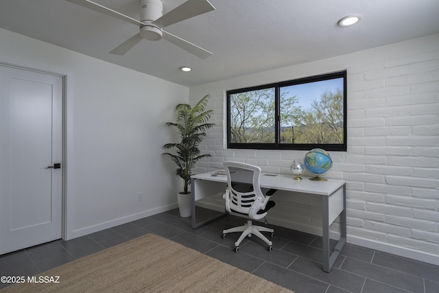 1720 W Cessna Way, Tucson, AZ 85755 - office with dark tile patterned floors, baseboards, a ceiling fan, brick wall, and recessed lighting