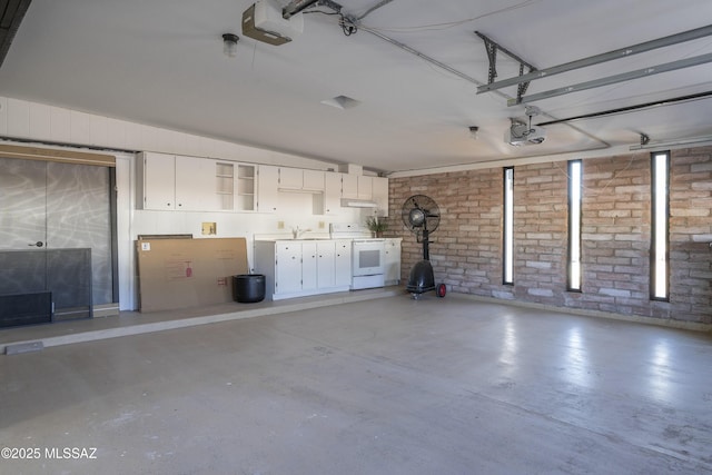 1720 W Cessna Way, Tucson, AZ 85755 - garage featuring a garage door opener and a sink