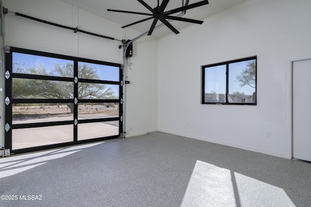1720 W Cessna Way, Tucson, AZ 85755 - empty room featuring a high ceiling, baseboards, a ceiling fan, and speckled floor