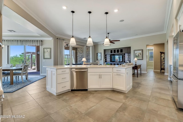 kitchen with ornamental molding, stainless steel appliances, open floor plan, and a ceiling fan