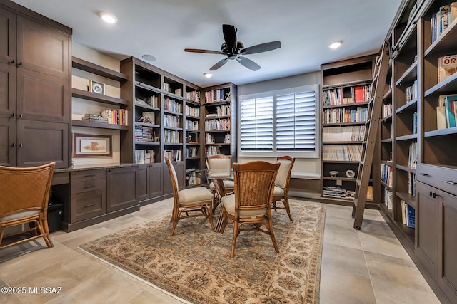 interior space with built in study area, ceiling fan, and recessed lighting