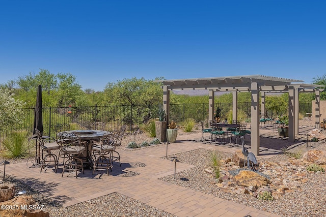 view of patio / terrace featuring outdoor dining space, a pergola, and fence