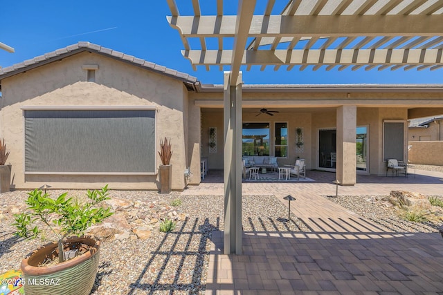 view of patio / terrace with a pergola and ceiling fan