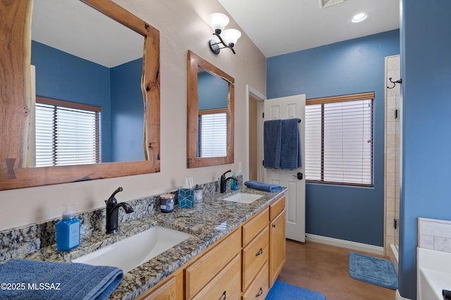 12489 N Owl Head Canyon Rd, Marana, AZ 85658 - full bathroom featuring baseboards, a wealth of natural light, and a sink