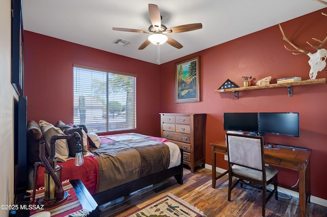 12489 N Owl Head Canyon Rd, Marana, AZ 85658 - bedroom with baseboards, visible vents, and wood finished floors