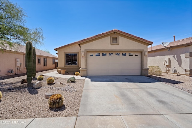 12489 N Owl Head Canyon Rd, Marana, AZ 85658 - single story home with concrete driveway, an attached garage, a tile roof, and stucco siding