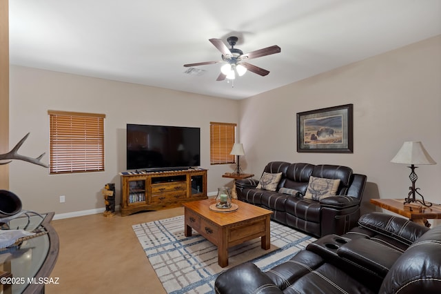 12489 N Owl Head Canyon Rd, Marana, AZ 85658 - living room with visible vents, a ceiling fan, baseboards, and light colored carpet