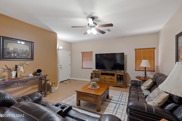 12489 N Owl Head Canyon Rd, Marana, AZ 85658 - living room featuring ceiling fan and visible vents