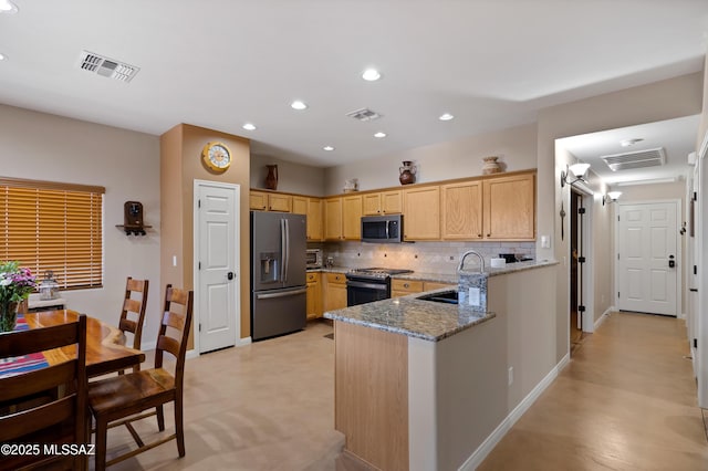 12489 N Owl Head Canyon Rd, Marana, AZ 85658 - kitchen with stainless steel appliances, visible vents, decorative backsplash, and a sink
