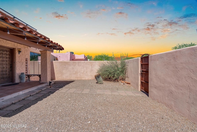2716 E 6th St, Tucson, AZ 85716 - fenced backyard with a patio area and a gate