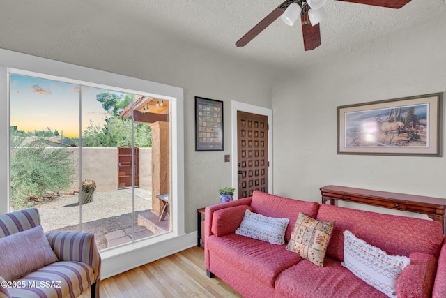 2716 E 6th St, Tucson, AZ 85716 - living area with light wood-style flooring, ceiling fan, and a textured ceiling