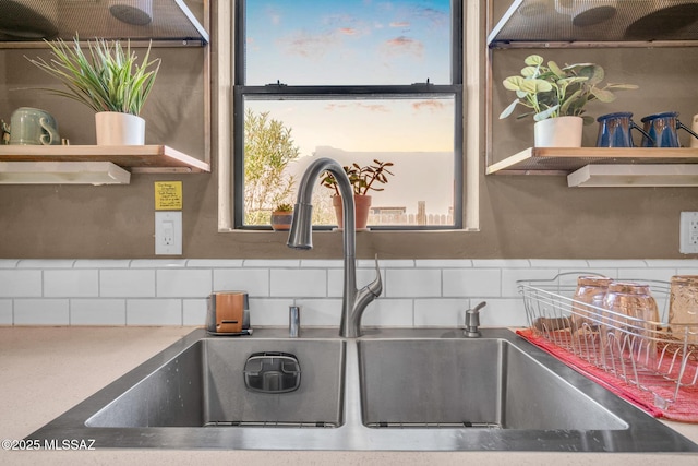 2716 E 6th St, Tucson, AZ 85716 - kitchen view of a sink, backsplash, and open shelves