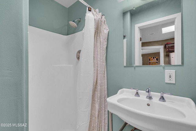 2716 E 6th St, Tucson, AZ 85716 - bathroom featuring a sink and curtained shower