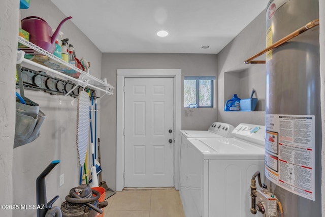 2716 E 6th St, Tucson, AZ 85716 - washroom with washer and clothes dryer, light tile patterned floors, and water heater