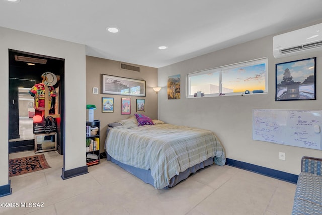 2716 E 6th St, Tucson, AZ 85716 - bedroom with a wall mounted AC, a spacious closet, a closet, recessed lighting, and light tile patterned flooring
