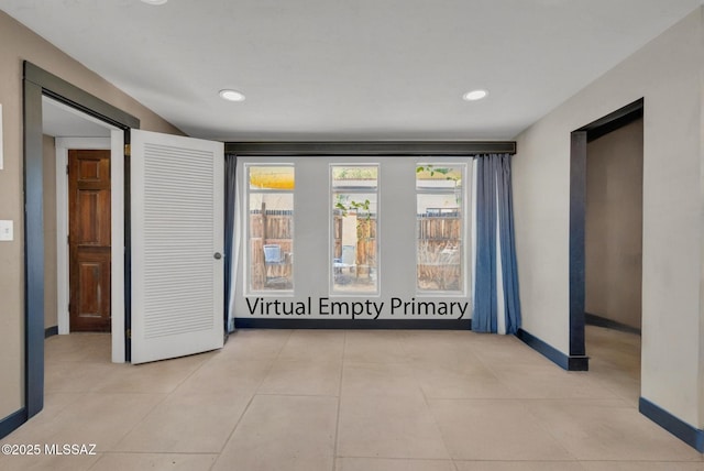 2716 E 6th St, Tucson, AZ 85716 - spare room with baseboards and recessed lighting
